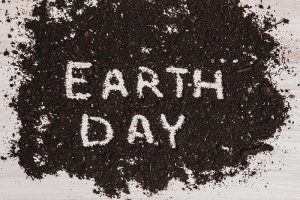 The words "earth day" written in soil