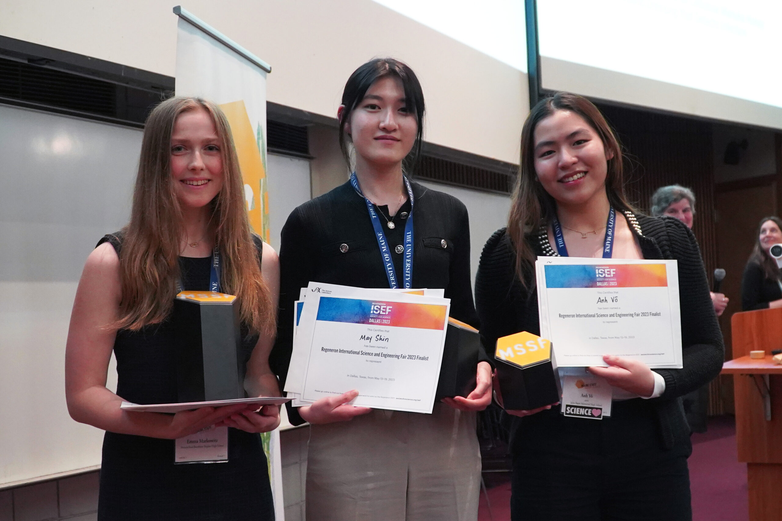 A photo showing three of the winners of the 2023 high school science fair.