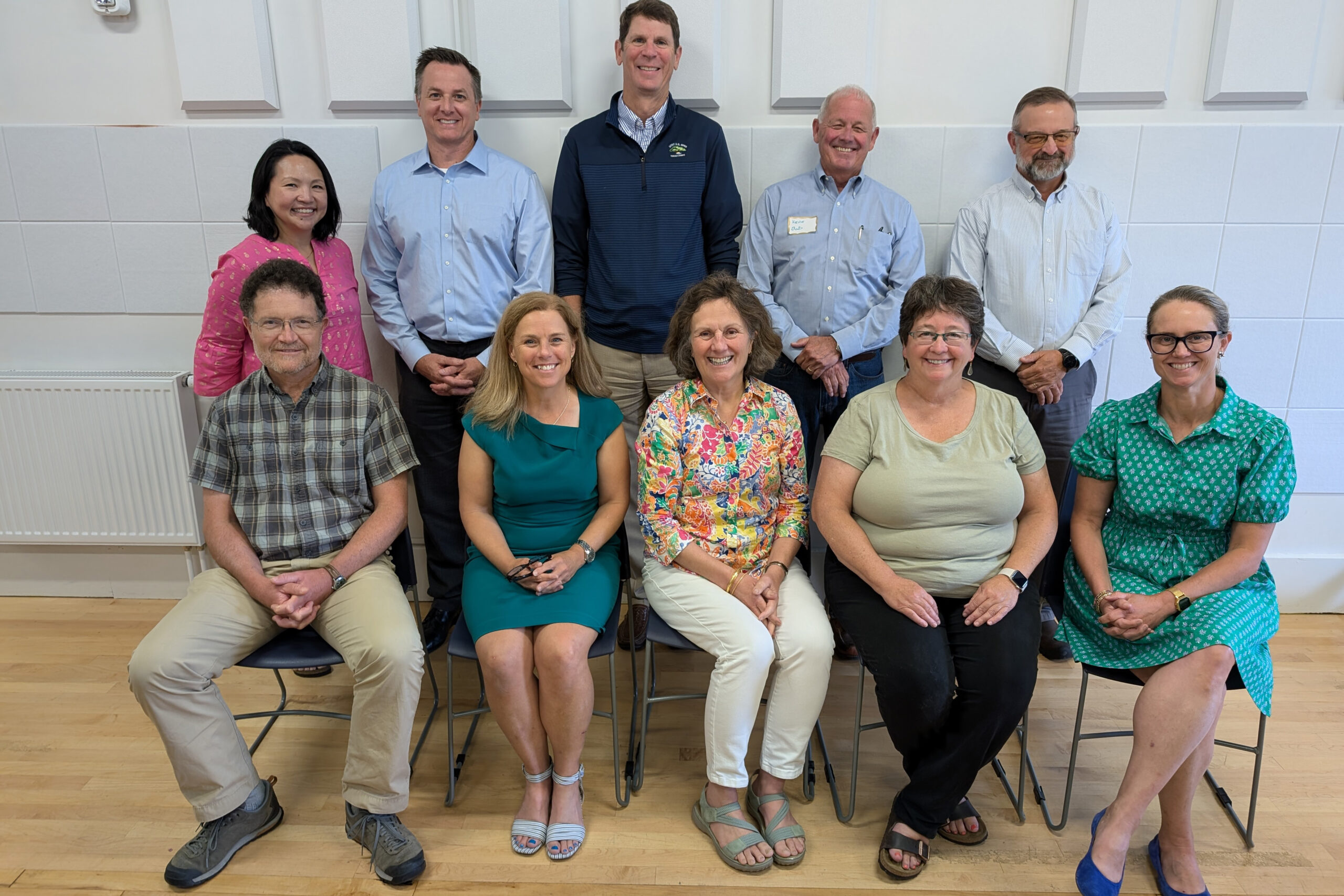 A photo of new and departing board members, including Glen Wider, Lily Lu, Andrew Forbes, Erica Beck Spencer, Jeff Hecker, Susan Bates, Kevin London, Margo Murphy, Stu Rich, and Lindsay Coe.