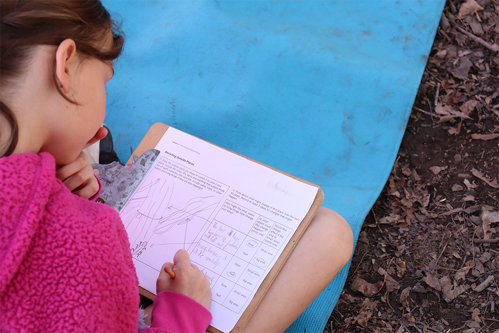 <span style="font-size: 12px; text-align: center;"> A student making a model of outdoor places as a part of Becky Hallowell's class.</span>