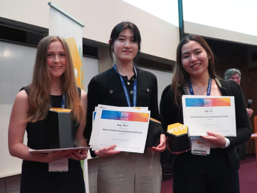 A photo showing three of the winners of the 2023 high school science fair.