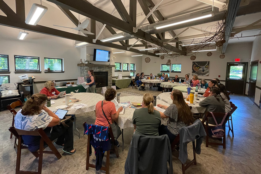 A photo of educators a conference room.