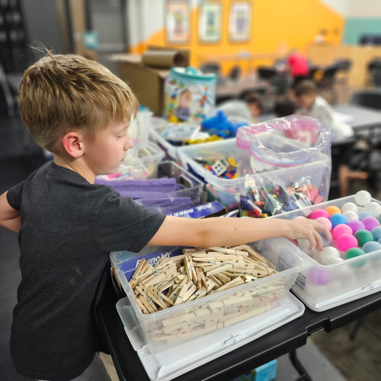A child engages with materials for a STEM activity in North Carolina.