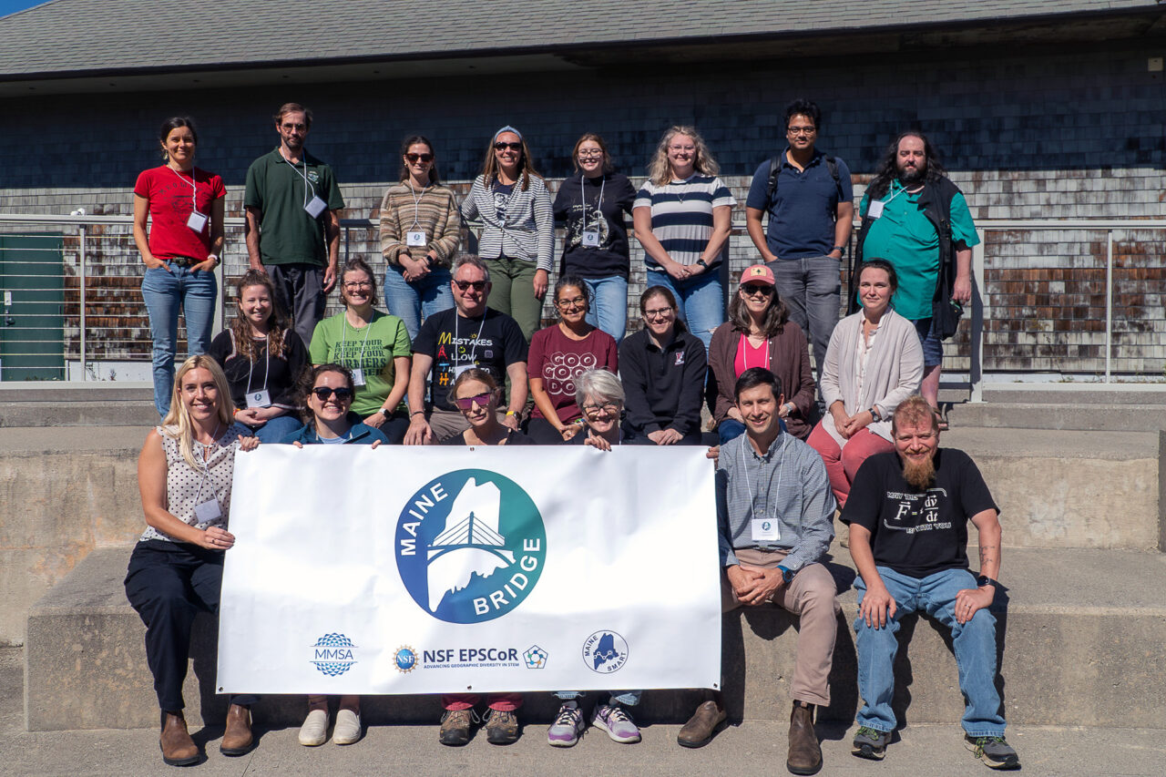 Maine Bridge participants and staff pose for a group photo at an event at the Schoodic Institute.