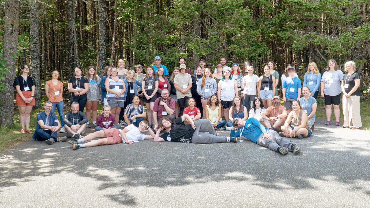 Rural Energy Futures staff and participants from both the middle and high school parts of the project are gathered in a group outside.