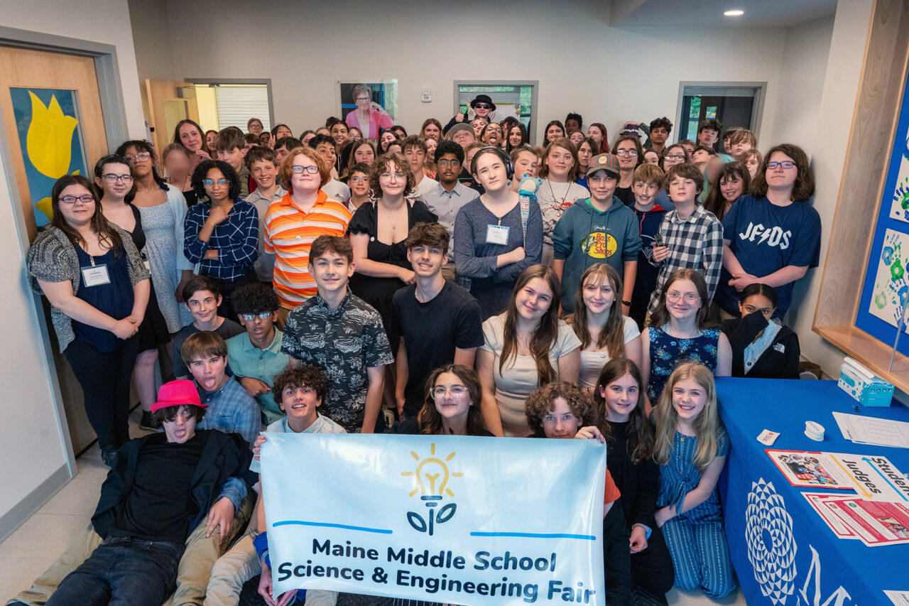 Students participants at the Maine Middle School Science Fair pose for a group phtoo.