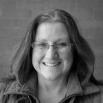 A headshot of Cheryl Tobey.